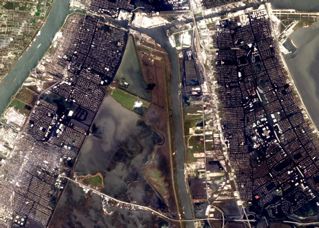 MR-GO navigation canal appears at center (vertical); Lower 9th Ward and St. Bernard Parish at left. Detail of NASA photo.